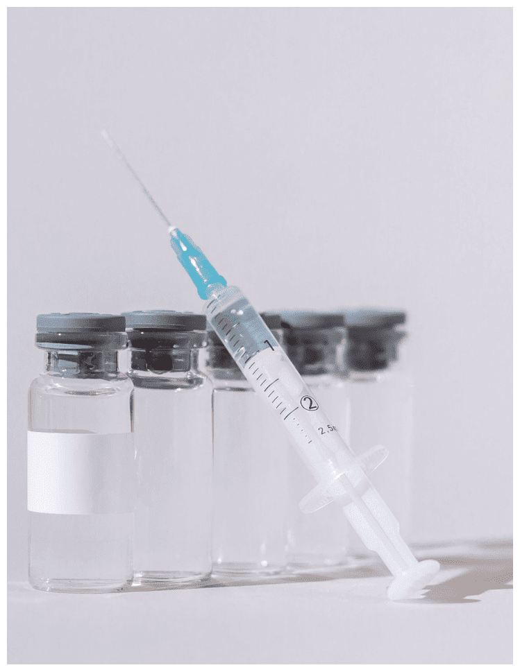 Syringe and vials of liquid medication.