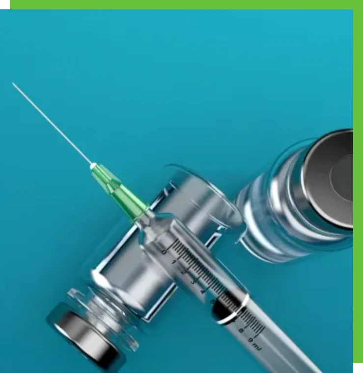 Syringe and vial on blue background.